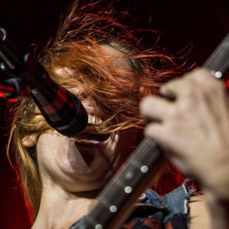 April Jones playing guitar and singing